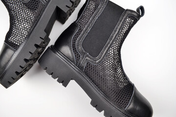 Stylish semi-transparent black women's mesh shoes with elastic band and massive sole, highlighted...
