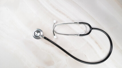 Stethoscope for medical on marble desk in hospital. Health care concept.