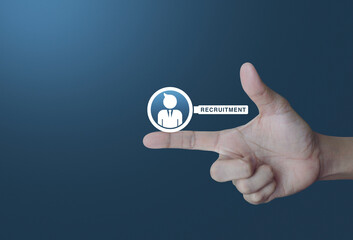 Businessman with magnifying glass icon on finger over light gradient blue background, Business recruitment concept