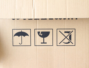 Packaging Symbols Set on Realistic Cardboard Background