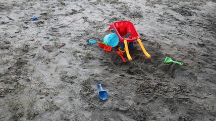 many colorful trolleys full and all kinds of toys in the Children's bunker  for the joyful concept of sandpit 