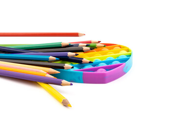 School supplies, children toy popit anti-stress on white background. Concept of the back to school.