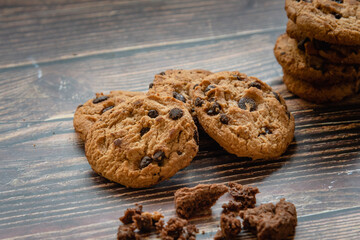 Homemade chocolate chip cookies for teatime on wooden table