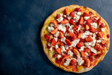 Strawberry and banana pizza with ricotta cheese and mango sauce.