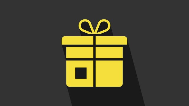 Yellow Gift box icon isolated on grey background. 4K Video motion graphic animation