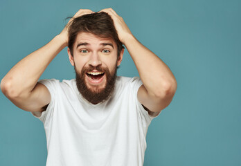 emotional man in a white t-shirt serious look close-up