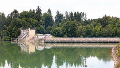 Panoramaview over Forggensee lake with the dam. The lake located north of Fussen in the district of Ostallgau in Bavaria, Germany. 