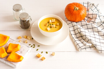 pumpkin soup with croutons and pumpkin seeds. dietary food.