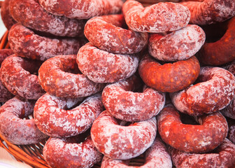 German sausage coils on sale in a French market