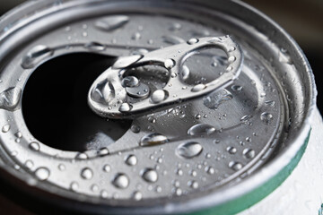 open aluminum can of drink. close-up. bar.