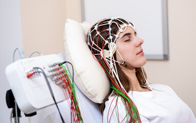 Patient brain testing using encephalography at medical center