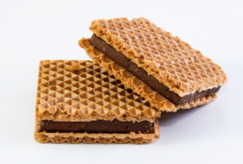 square wafer with chocolate filling on white background