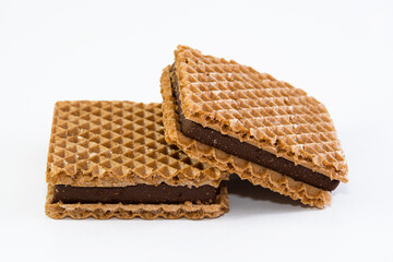 square wafer with chocolate filling on white background