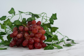 A bunch of freshly washed grapes and vines. Selective focus points. Blurred background