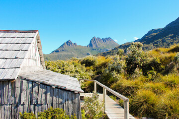 Fototapeta premium Wooden cabin in foreground of Cradle Mountain Dove Lake Tasmania Australia. No people, space for copy.