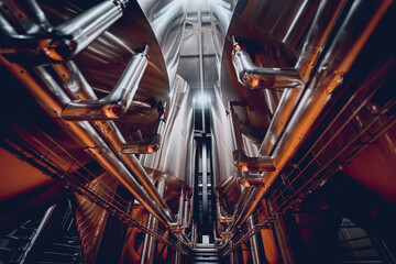 Rows of steel tanks for beer fermentation and maturation in a craft brewery