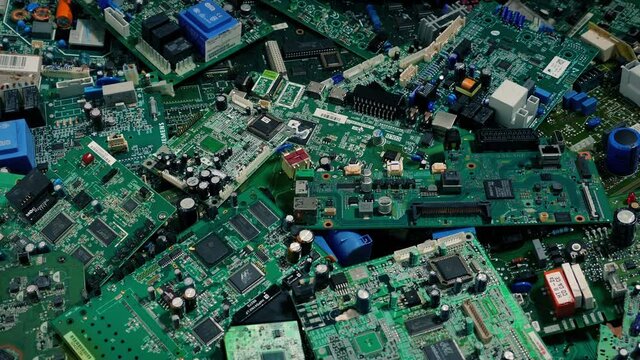 Computer Circuit Boards Pile Moving Shot