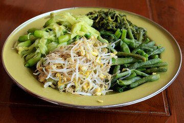 Various Boiled Vegetable for Pecel (Nasi Pecel), Traditional Dish from Indonesia, Spicy Sauce Made from Peanut with Chilli Paste