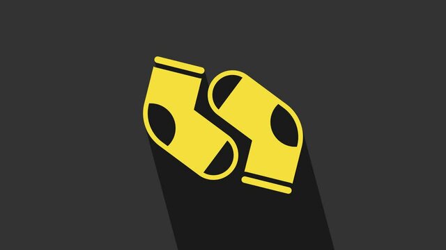 Yellow Socks icon isolated on grey background. 4K Video motion graphic animation