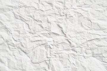 White crumpled paper texture with wrinkles. Damaged and torn sheet