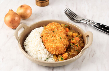 Chicken Katsu with Japanese Curry, Serve with White Rice on Brown Ceramic Plate above White Marble Table, Iwith Copy Space for Text or Recipe