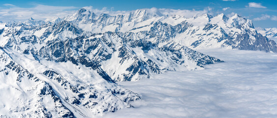 Fototapeta premium Switzerland, Panoramic view on Snow Alps and Blue Sky around Titlis mountain