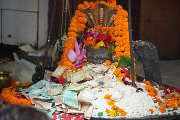 shiva linga with money image