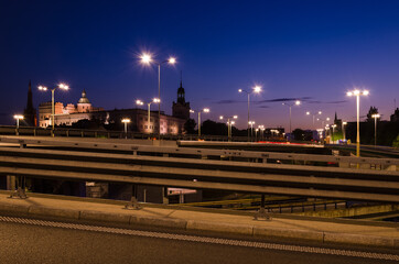 Fototapeta na wymiar CITY AT NIGHT - The modern road infrastructure of a big city with historic Castle of Pomeranian Dukes in background 