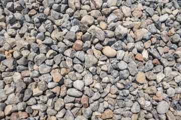Construction crushed stone. Crushed stone on the beach on a sunny day close-up.