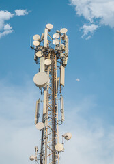 Relay tower with many antennas against the sky