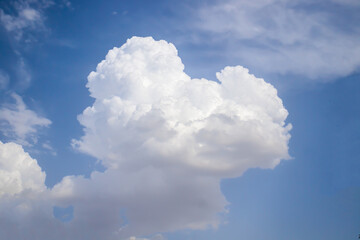 Naklejka na ściany i meble Beautiful cumulus cloud in the sky