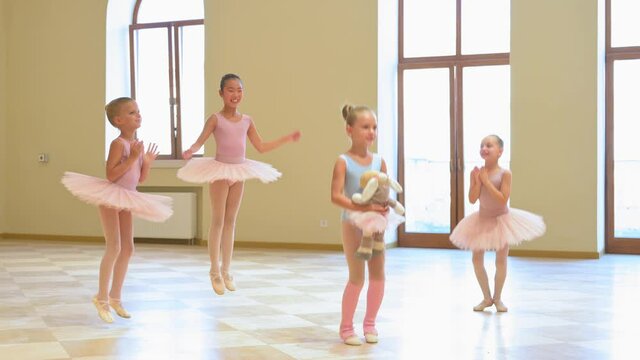 Adorable class of young ballerinas at a rehearsal