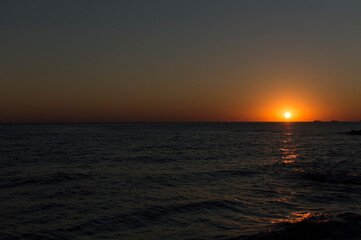 Landscape. A sunny sunset on the seashore.