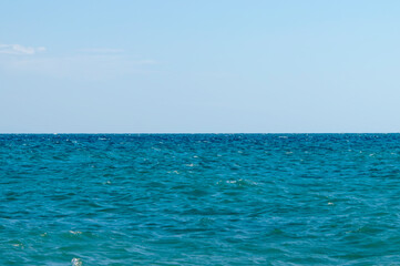 Fototapeta na wymiar Panorama of the sea horizon in calm. The concept of tourism and recreation. Selective focus.