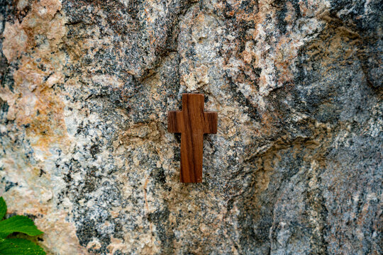 Against the backdrop of a rock section, Wooden Cross.