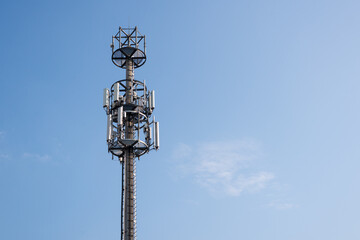 Fototapeta na wymiar Telecommunication mast against blue sky