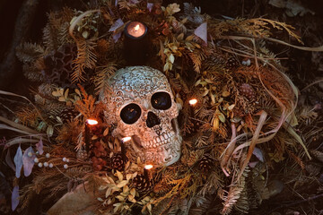 human skull, candles, dry leaves on dark background. magic esoteric ritual. Mysticism, divination, wicca, occultism, Witchcraft concept. symbol of samhain sabbat, Halloween - obrazy, fototapety, plakaty