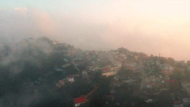Aerial view of a small township along the mountain crest near Gun Hills, Landour, Mussoorie, India.