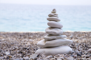Stack of stones on beach. Zen meditation background. 
