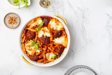 baked penne pasta with meatballs and mozzarella