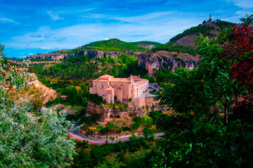 Obraz premium Cityscape in old town in daylight. Parador Nacional, former Convent of San Pablo in the old town in Cuenca, World Heritage Site, Spain. Horizontal view