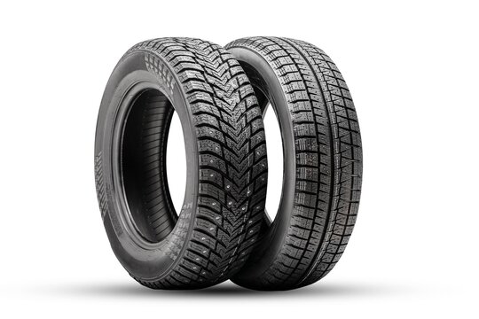 winter tires wheels are new isolate. friction velcro wheel and studded tire next to two pieces
