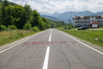 road in the mountains with the inscription start