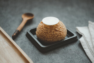 Choux cream on the brown plastic tray
