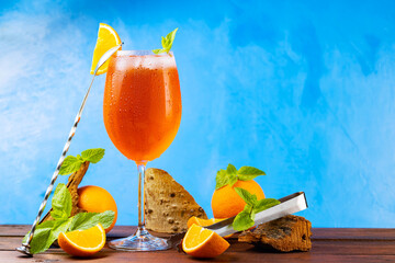 Cocktail aperol spritz and bar accessories. Italian aperol spritz cocktail and a sliced orange on a...