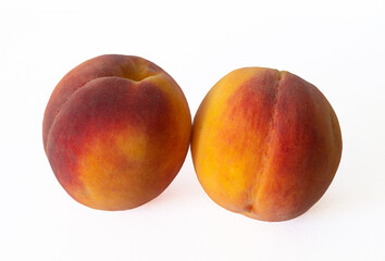 two peaches on a white background
