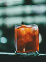 Fresh made Cuba Libre cocktail with brown rum, cola and lemon in bar