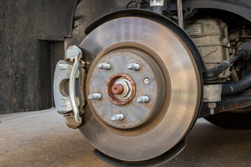 Vehicle brakes parts. Caliper and rotor on car. Brake inspection, repair, service and maintenance...