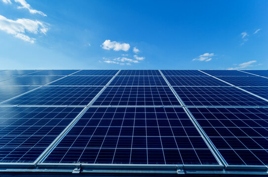 Photovoltaic Solar Panels On Blue Sky Background