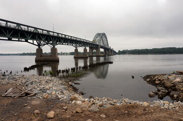 Tacony Palmyra Bridge Rocky Dirt Beach View of New Jersey over Dalaware River Overcast Day